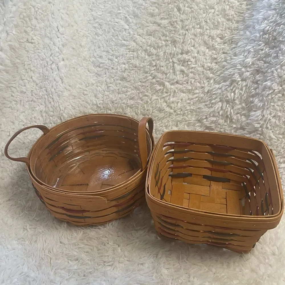 Longaberger 1995 set of two Handcrafted round and Square Woven baskets .